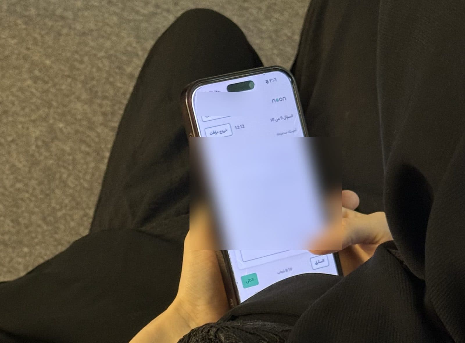 A trainee answering a competency scenario question in the portal on a phone